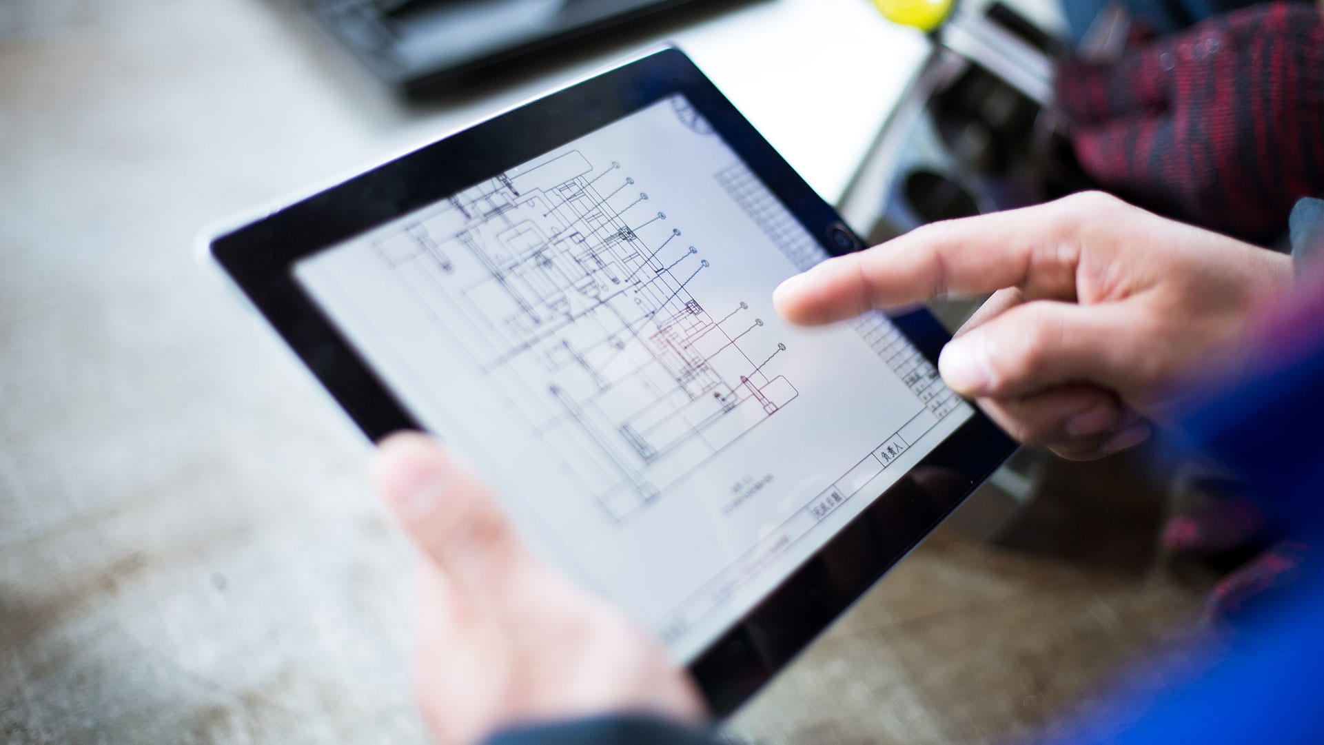 Person using a tablet for OEM support